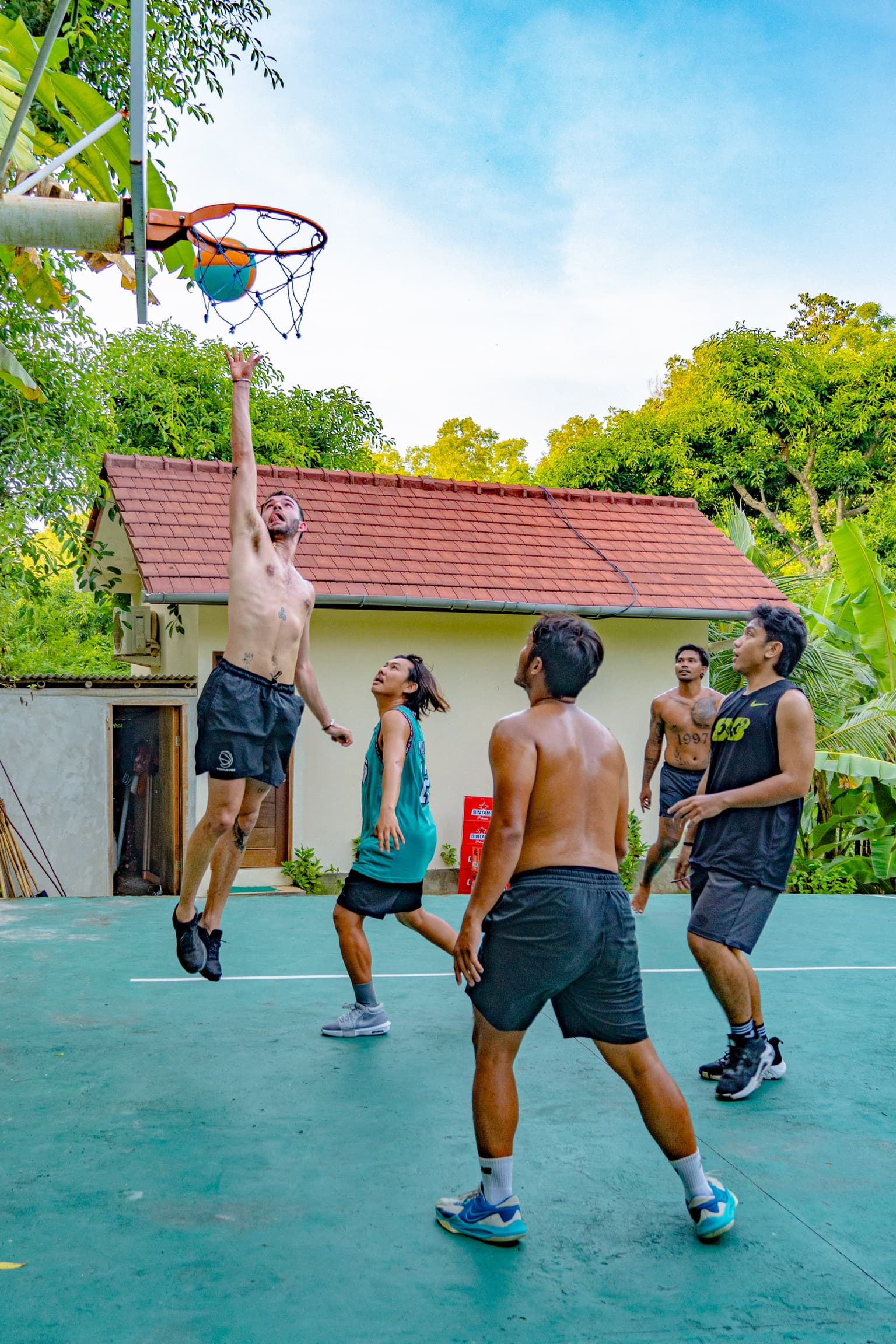 Guests and local players competing on The Penida Project basketball court